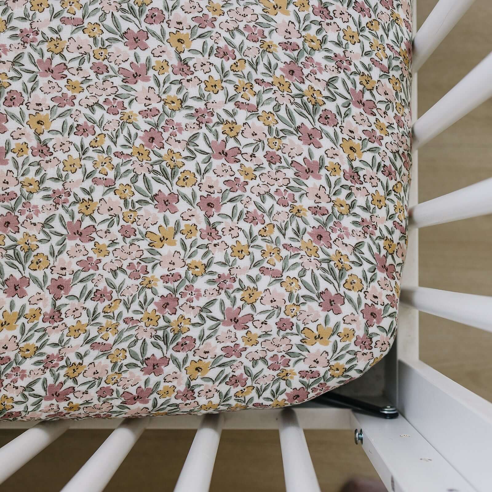 Sunny Petals Muslin Crib Sheet | Transform your baby's crib into a cozy haven with our Sunny Petals Muslin Crib Sheet. Crafted from our exclusive soft and breathable muslin fabric, this sheet showcases a neutral design that adds a touch of warmth and styl