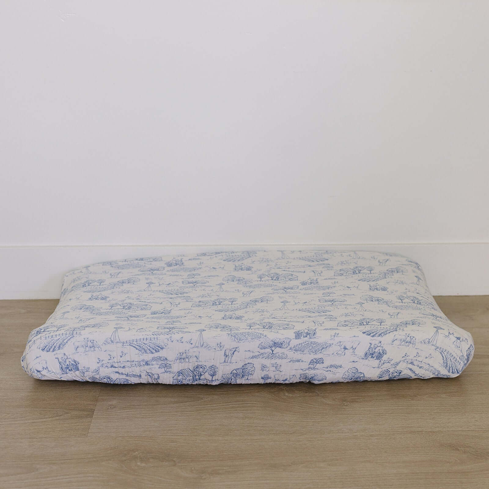 Farm Toile Muslin Changing Pad Cover | Transform your baby's changing area with the Mebie Baby Farm Toile Muslin Changing Pad Cover. Made from soft and breathable muslin fabric, this cover is gentle on your baby's skin. The fun design adds a touch of mode