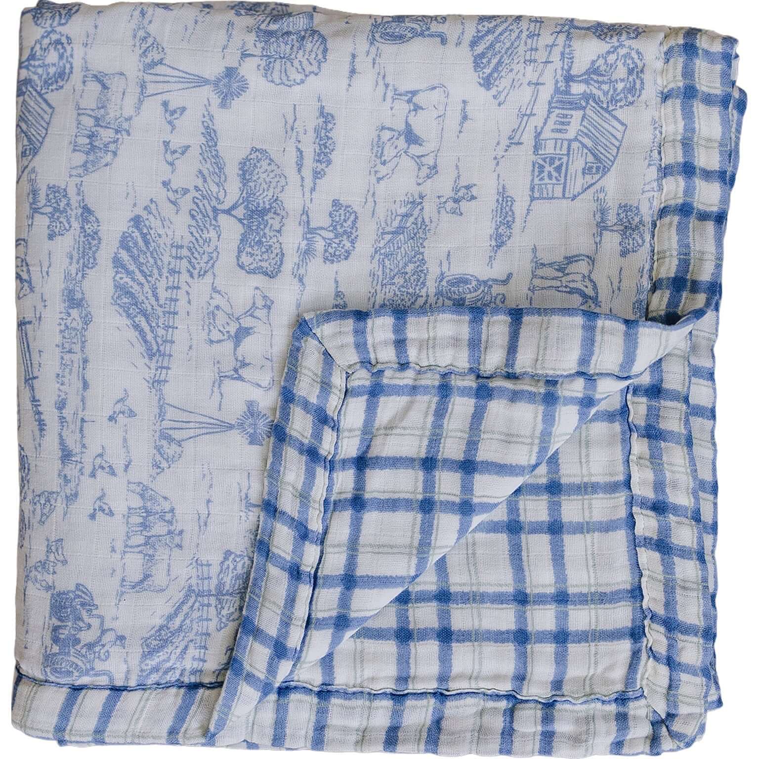 Farm Toile + Blue & Green Plaid Muslin Quilt | Indulge your little one in the cozy comfort of our Muslin Quilt. Crafted from the same fabric as our beloved muslin swaddles, this four-layer quilt offers warmth and softness for a restful sleep. Our neutral