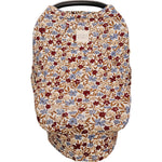 Desert Floral Ribbed Bamboo Multi-Use Cover shown on a car seat, featuring vibrant floral patterns and a sustainable fabric design.