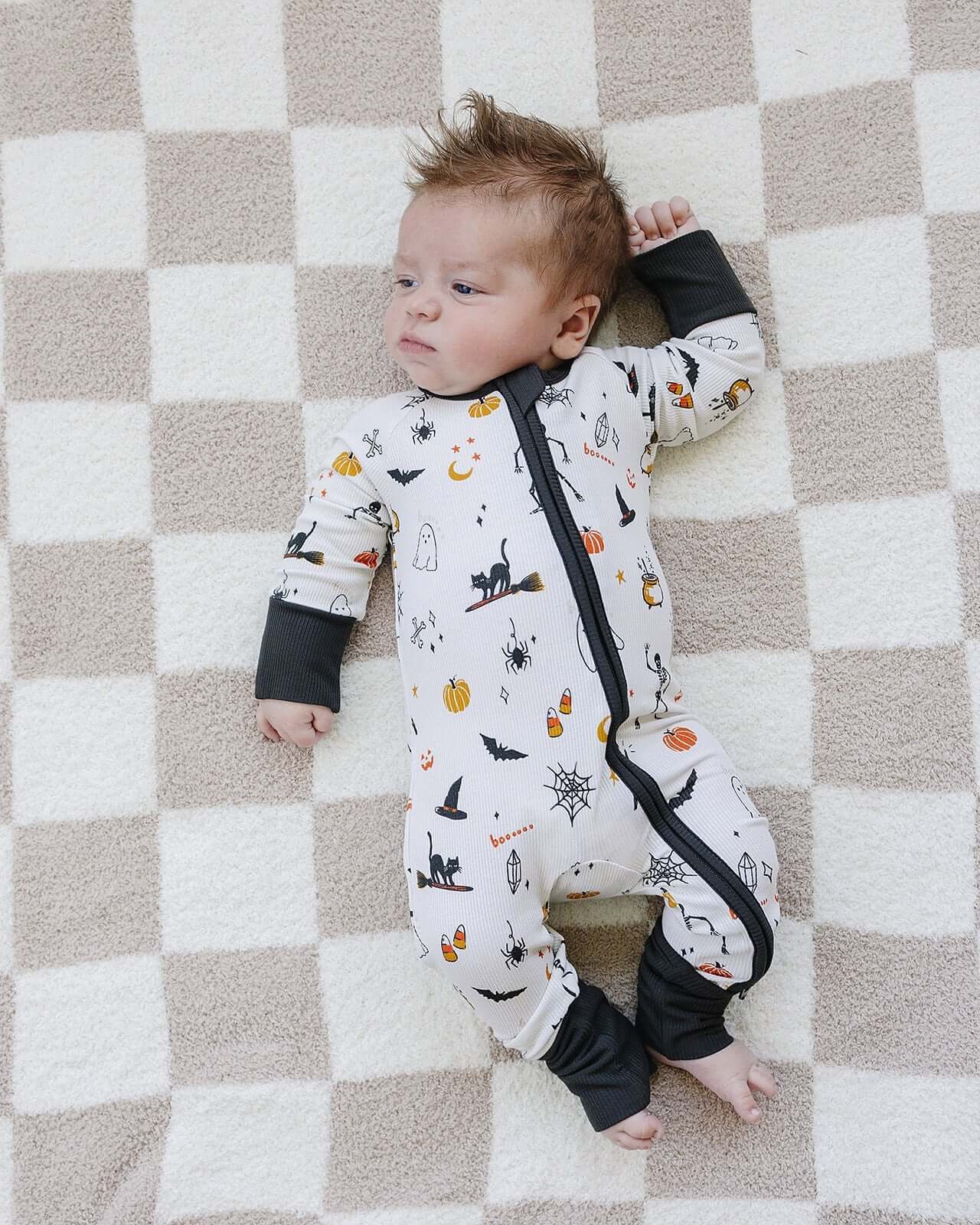 Halloween Bamboo Zipper | Get your little one ready for Halloween with our cozy Halloween Pajamas! Featuring a festive pumpkin print, this bamboo zipper onesie is pure comfort. | Milk & Baby