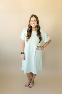 Woman wearing a soft and breathable Bamboo Labor & Delivery Gown in light color, designed for comfort during and after pregnancy.