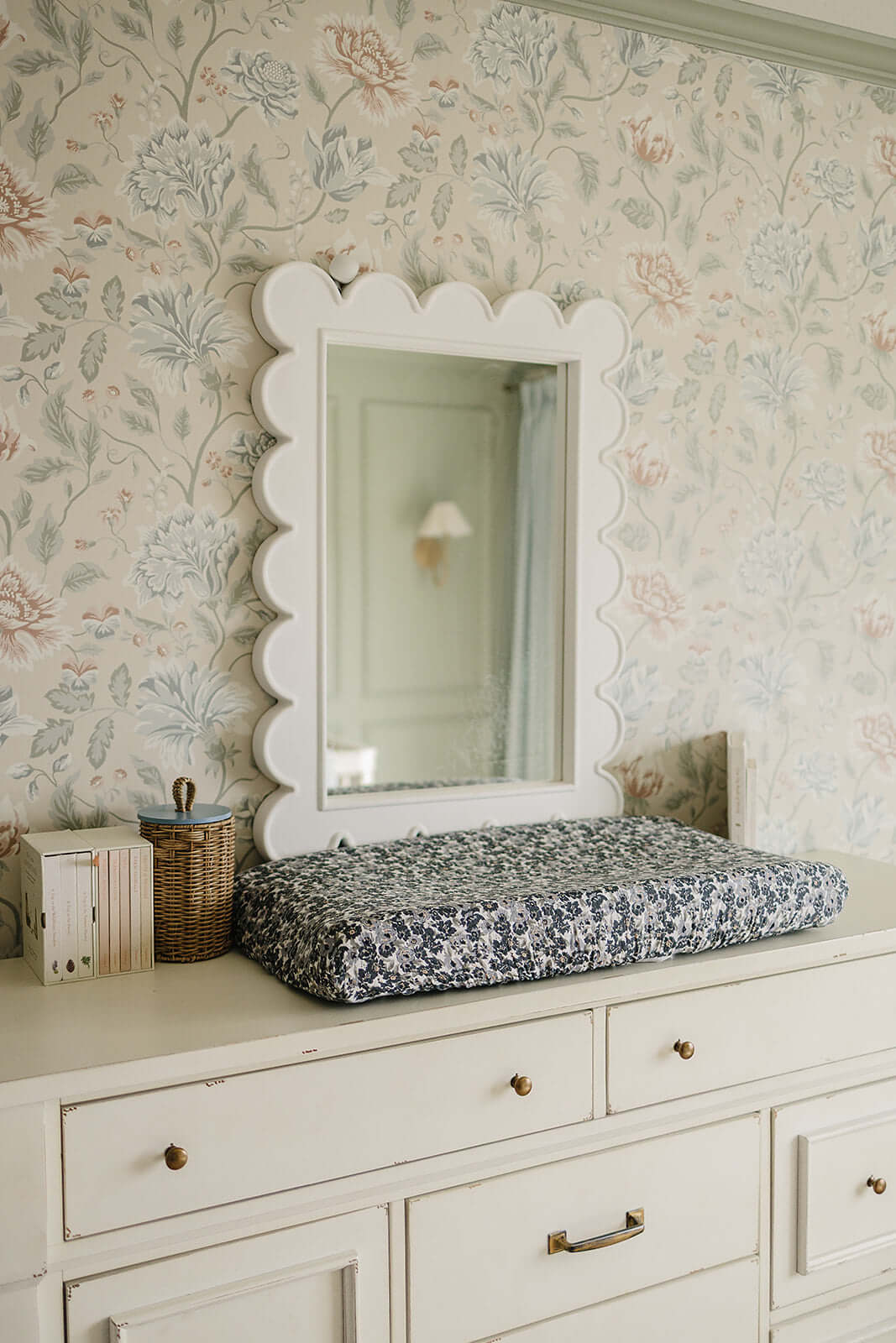 Liberty Floral Muslin Changing Pad Cover | Transform your baby's changing area with the Mebie Baby Cream Berry Muslin Changing Pad Cover. Made from soft and breathable muslin fabric, this cover is gentle on your baby's skin. The checkered design adds a to