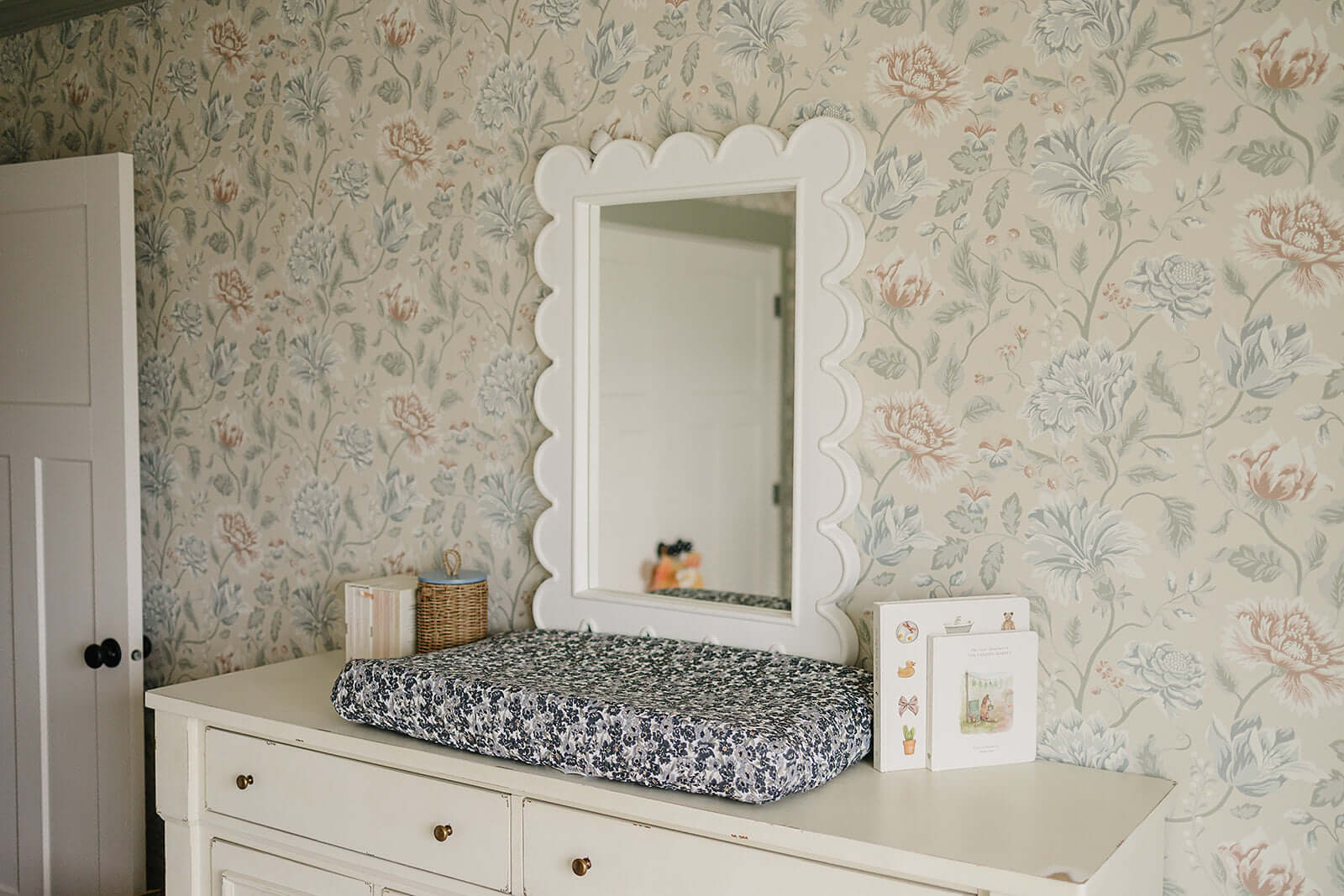 Liberty Floral Muslin Changing Pad Cover | Transform your baby's changing area with the Mebie Baby Cream Berry Muslin Changing Pad Cover. Made from soft and breathable muslin fabric, this cover is gentle on your baby's skin. The checkered design adds a to