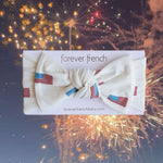 Americana |  Ribbed Bamboo Head Wrap featuring a stylish bow and festive colors, perfect for babies and toddlers.