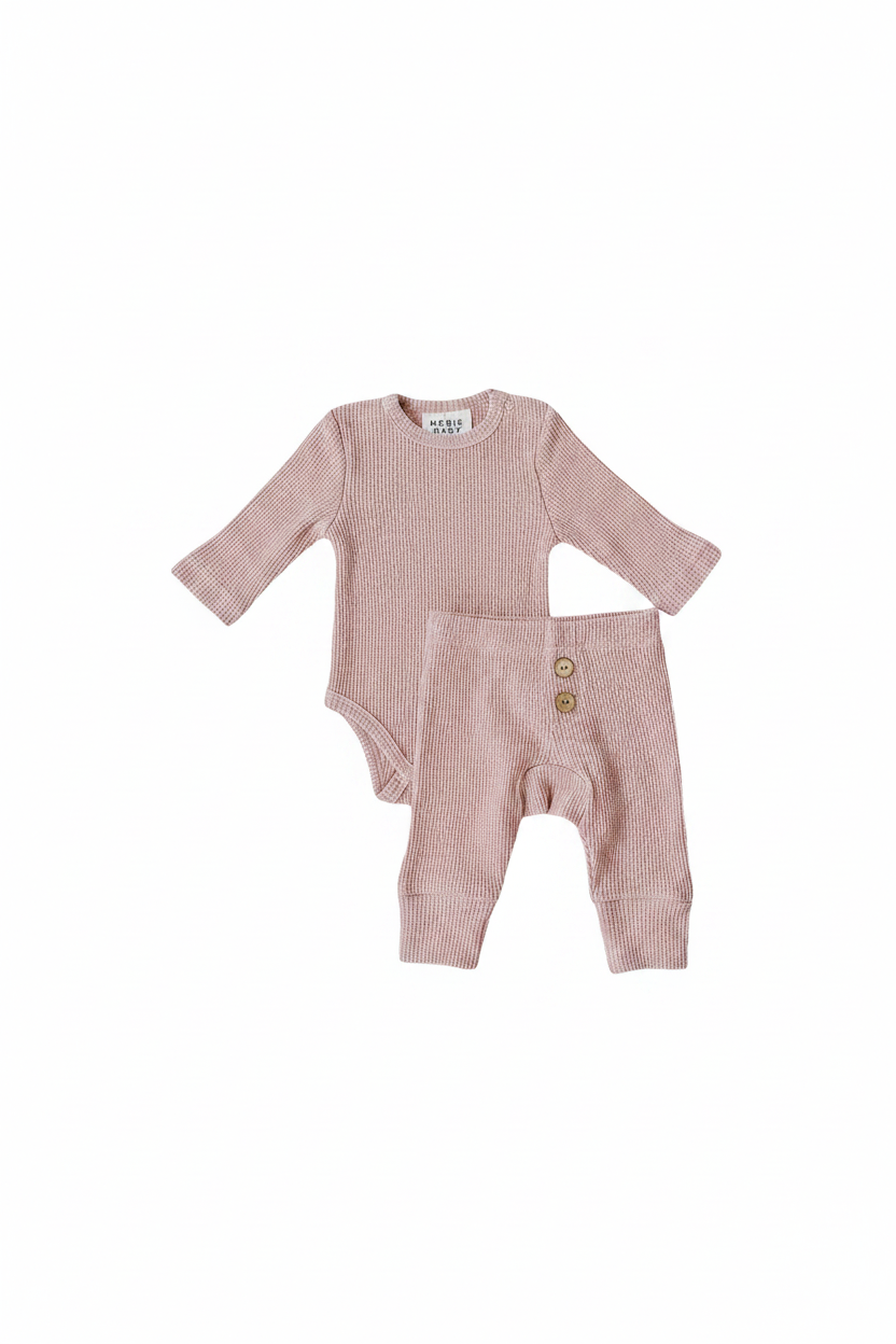 Pink Waffle Set | Milk & Baby | Comfy, cozy, and cute — our Pink Waffle Set is an everyday essential. Made from soft waffle-knit fabric, this matching set includes a long sleeve bodysuit and relaxed-fit pants for a cozy, all-day feel. Snaps at the bottom