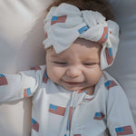 Americana |  Ribbed Bamboo Head Wrap on a smiling baby girl wearing American flag print outfit.