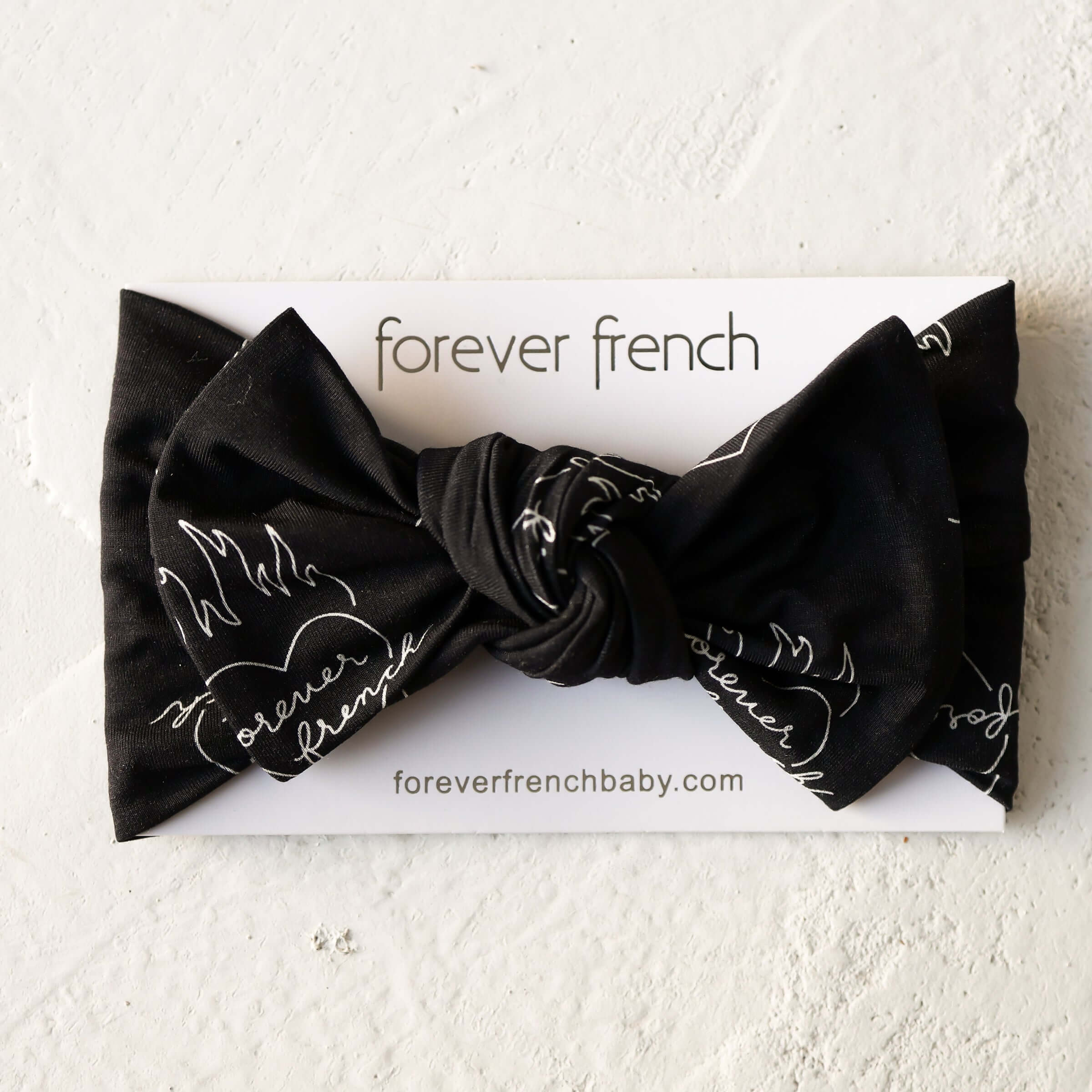 Flaming Hearts | Bamboo Head Wrap | Made from silky-soft bamboo material, this adjustable head wrap features a sweet bow for added style. Perfect for babies and toddlers!One size fits most Print: Flaming Hearts (a flame heart motif featuring "forever fren