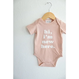 Hi, I'm New Here in Rose Organic Cotton Baby Onesie | Milk & Baby