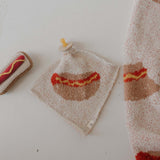 Knit Rattle | Hot Dog with colorful design, perfect for summer fun and cheerful jingles, by Forever French Baby.