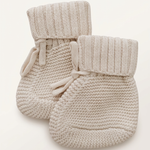 Oatmeal knit booties with more space and a subtle background