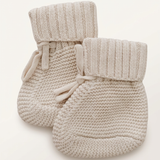 Oatmeal knit booties with more space and a subtle background
