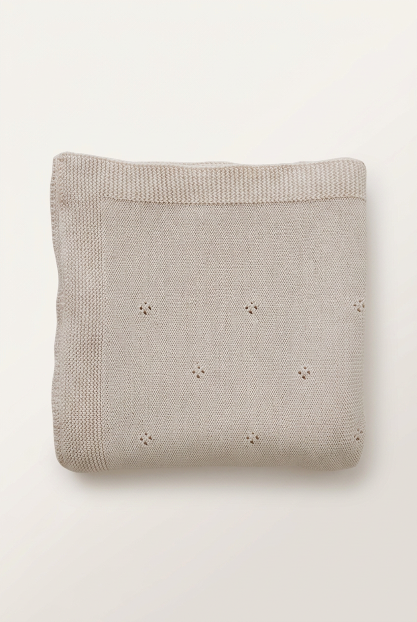 Oatmeal pointelle blanket with more space and a subtle background