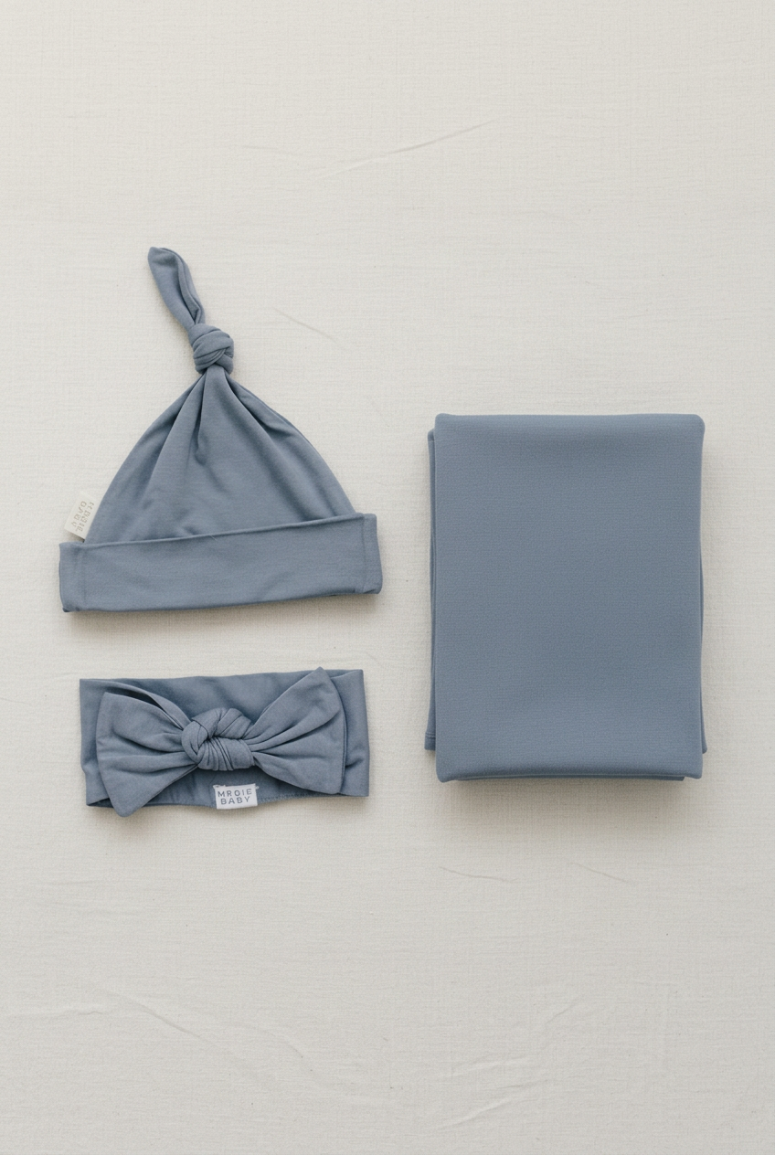 Portrait dusty blue swaddle set with extra breathing room
