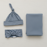 Portrait dusty blue swaddle set with extra breathing room