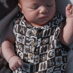 Baby wearing Summer Check | Muslin Tank Romper, featuring a button front and checker print design.
