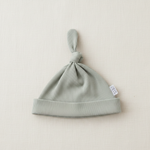 Sage Organic Ribbed Newborn Knot Hat - Minimal Flat Lay
