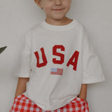 Child wearing USA cotton tee, perfect for festive occasions, representing USA Mommy & Me style.