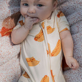 Baby wearing Hot Dogs | Shortie Bamboo Zip romper, showcasing fun hot dog prints | milk & baby.