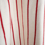 Close-up of soft knit fabric in red and white stripes for the Picnic Pinstripe | Knit Ruffle Romper.