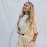 Model wearing Veda Women's Boxy Tee Lounge Set in a light color, showcasing comfort and style for lounging.