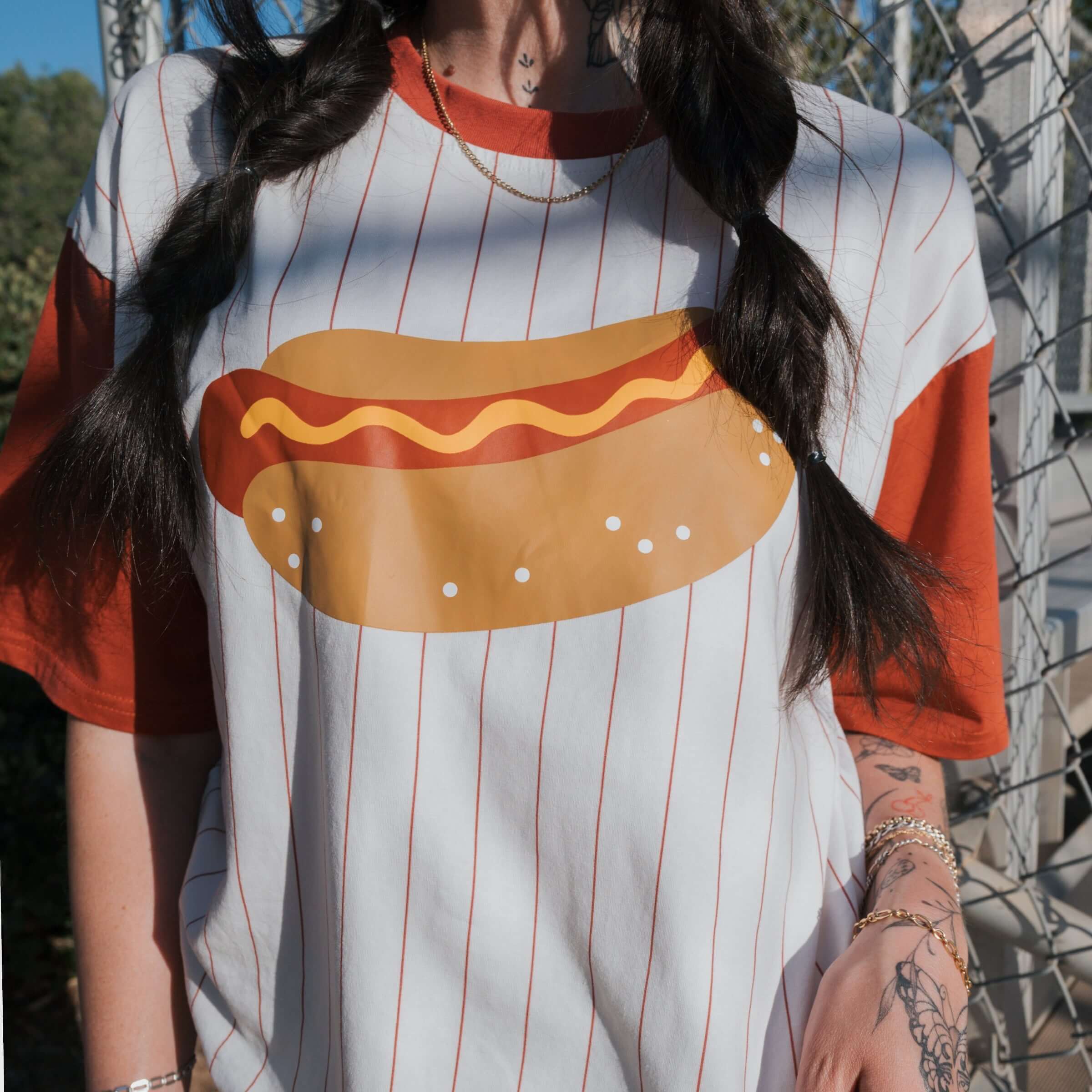 Hot Dogs | Adult Cotton Tee featuring a colorful hot dog graphic on a stylish striped shirt.
