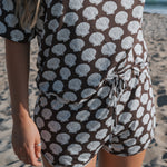 Women's Bamboo Short Set featuring a seashell print, comprising an oversized t-shirt and matching drawstring shorts.
