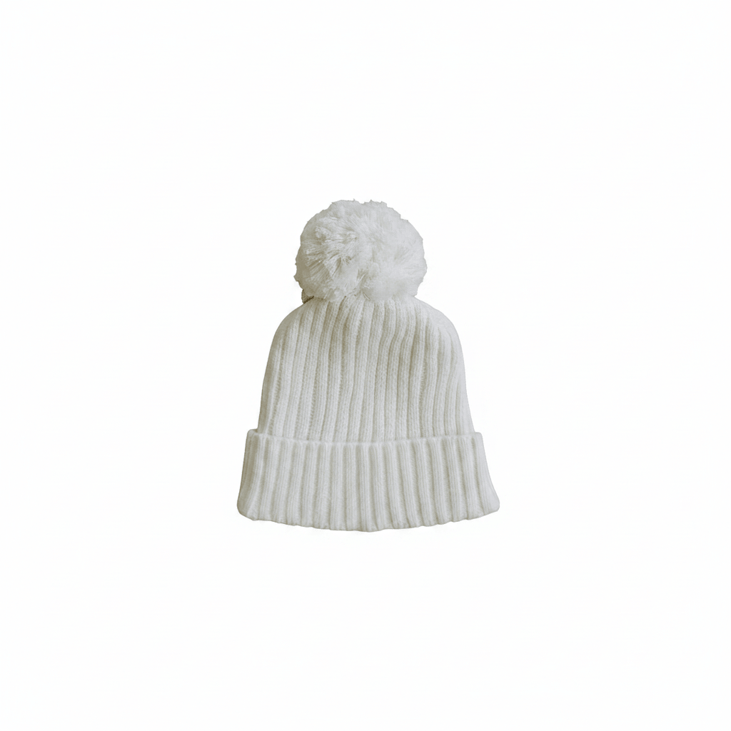 White Knit Beanie | Mebie Baby's White Knit Beanie is crafted in the same soft, timeless knit as our White Knit Bloomer Set, creating a beautifully coordinated look. Designed to keep little ones cozy while adding classic charm, this beanie is perfect for