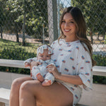 Americana  | Ribbed Bamboo Zip Pajamas worn by a mother holding her baby outside.