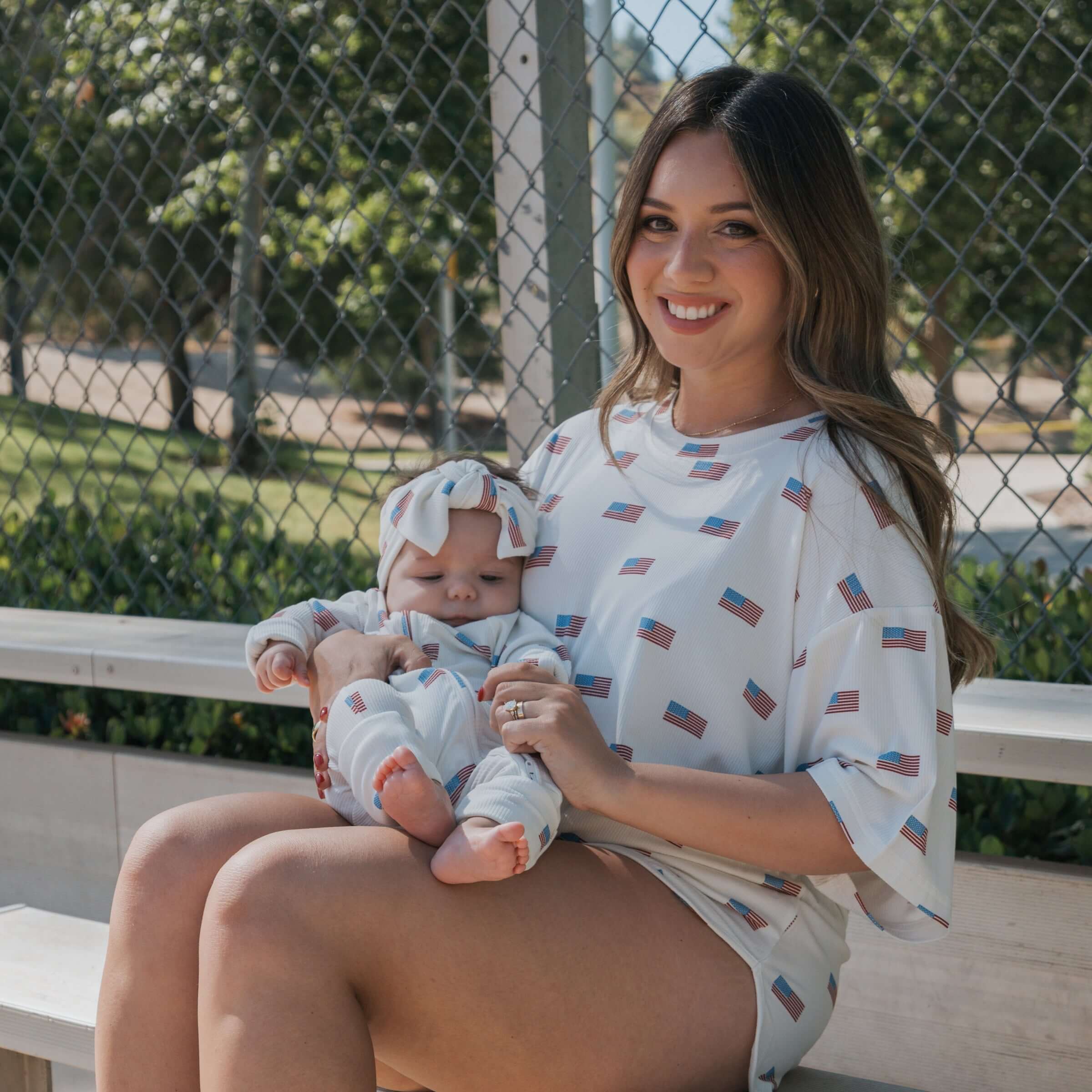 Model wearing Americana | Ribbed Women's Bamboo Short Set with baby in matching outfit, enjoying sunny day outdoors.