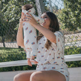 Americana |  Ribbed Women's Bamboo Short Set model wearing matching t-shirt and holding baby in patriotic outfit.