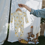 Lemon Bamboo Zip Pajamas on a hanger showcasing the soft bamboo fabric and cute lemon design for kids.