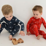 Police Cruiser | Bamboo Zip Pajamas | Made of the softest premium bamboo. Durable and well designed your little ones can sleep and play in these cozy pajamas. All sizes have rollover cuffs on the hands and on the feet giving you the option to go footless